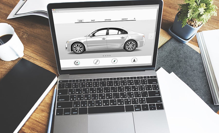 A laptop with a car image on it